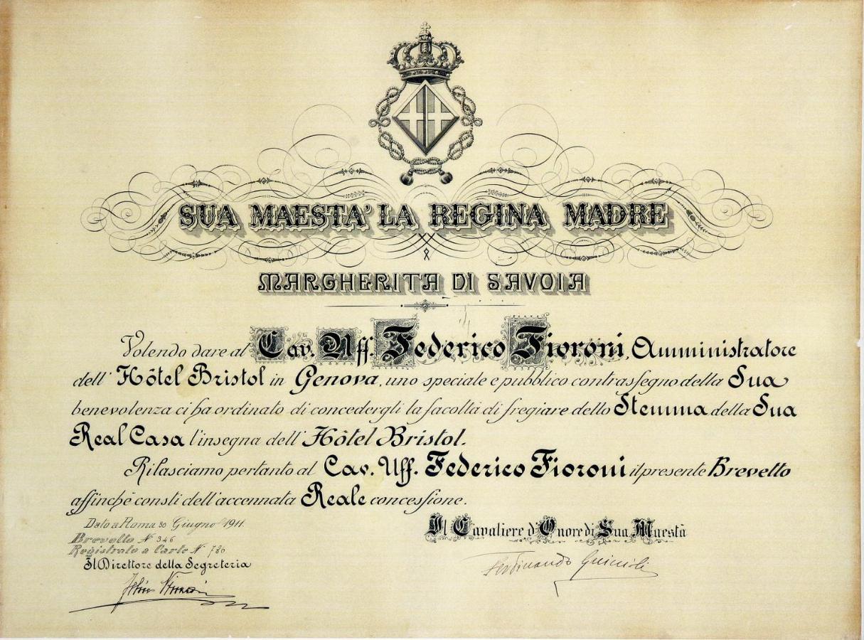 Hotel Bristol Palace Genoa Exterior photo The image depicts an ornate certificate or document that appears to be an official acknowledgment or commendation. It is written in Italian and features a royal crown at the top. The document is addressed to "Sua Maestà la Regina Madre" (Her Majesty 